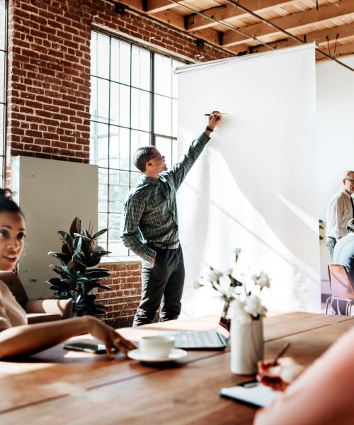 businesspeople-brainstorming-in-a-meeting-2023-11-27-05-33-55-utc